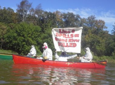 The "Climate Change Containment Unit" protesting Line 9 on the Grand River.