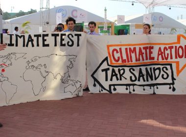 Activists with signs at COP20